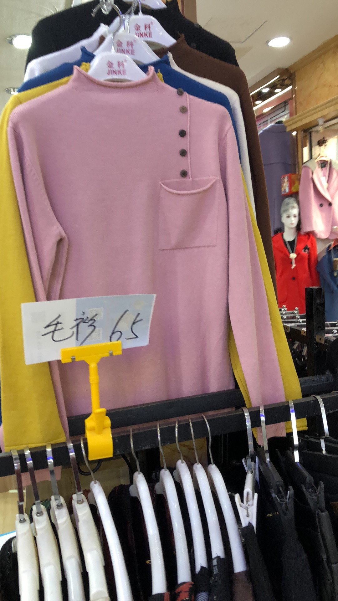 2018秋冬女士不对称钮扣针织