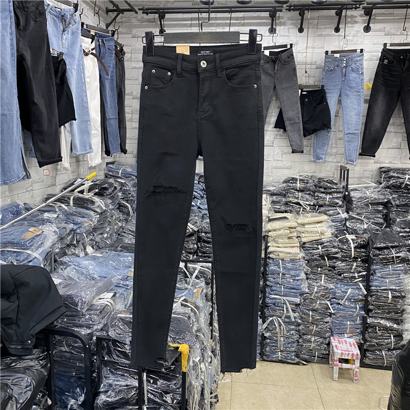 秋季不规则裤脚高腰修身显瘦破洞百搭小脚牛仔九分裤女